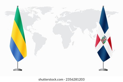 Gabon and Dominican flags for official meeting against background of world map.