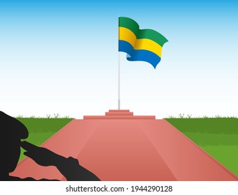 The Gabon flag flew above the pole in the image of a soldier saluting the flag