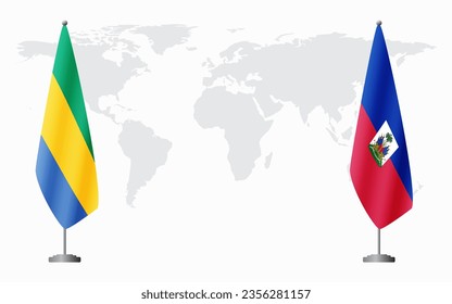 Gabon and Haiti flags for official meeting against background of world map.