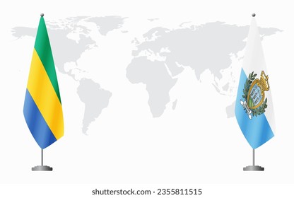 Gabon and San Marino flags for official meeting against background of world map.