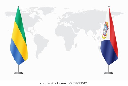 Gabon and Sint Maarten flags for official meeting against background of world map.