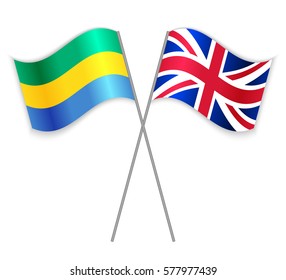 Gabonese and British crossed flags. Gabon combined with United Kingdom isolated on white. Language learning, international business or travel concept.