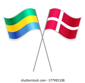 Gabonese and Danish crossed flags. Gabon combined with Denmark isolated on white. Language learning, international business or travel concept.