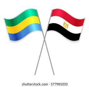Gabonese and Egyptian crossed flags. Gabon combined with Egypt isolated on white. Language learning, international business or travel concept.