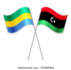 Gabonese and Libyan crossed flags. Gabon combined with Libya isolated on white. Language learning, international business or travel concept.
