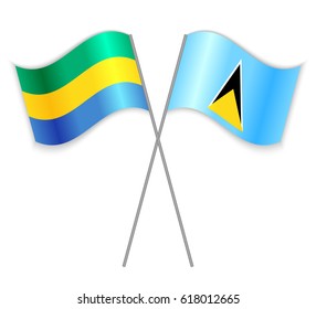 Gabonese and Saint Lucian crossed flags. Gabon combined with Saint Lucia isolated on white. Language learning, international business or travel concept.