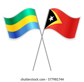 Gabonese and Timorese crossed flags. Gabon combined with East Timor isolated on white. Language learning, international business or travel concept.