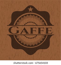 Gaffe badge with wood background