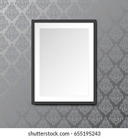 Gallery interior with empty black frame on the wallpaper with ornaments background. Vintage background. Can be used as mock up. Blank canvas.