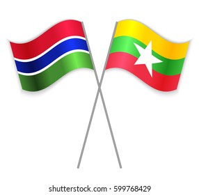 Gambian and Burmese crossed flags. Gambia combined with Myanmar isolated on white. Language learning, international business or travel concept.