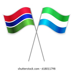 Gambian and Sierra Leonean crossed flags. Gambia combined with Sierra Leone isolated on white. Language learning, international business or travel concept.