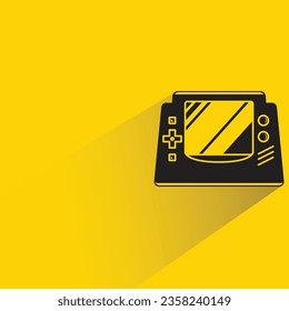 consola de juegos con sombra sobre fondo amarillo