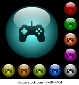 Game controller icons in color illuminated spherical glass buttons on black background. Can be used to black or dark templates