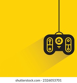 joystick de juegos con sombra sobre fondo amarillo