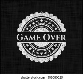 Game Over chalk emblem written on a blackboard