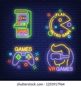 Game room neon sign set. Retro arcade machine, vr headset, gamepad on brick wall background. Vector illustration in neon style for topics like gambling, amusement, videogame