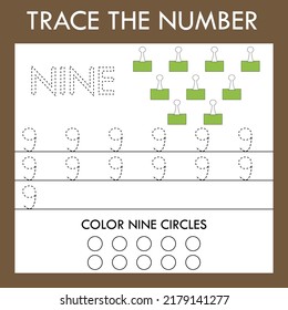 A game of tracing the outlines of the number four with green  paperclips. Preschool worksheet, kids activity sheet, printable worksheet