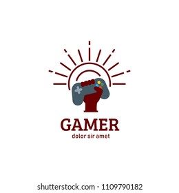 Gamer gamepad console raising hand with sunburst sunshine logo