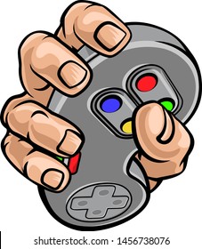 A gamer hand holding video gaming game controller 