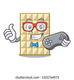 Gamer white chocolate on mascot wood table