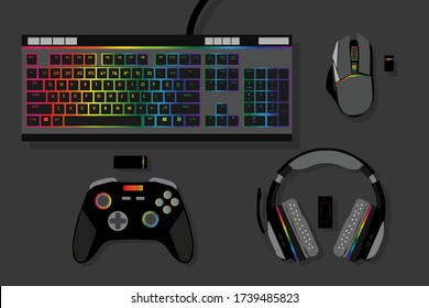 gamer workspace concept, top view a gaming gear, mouse, keyboard, joystick, headset, mobile joystick, in ear headphone and mouse pad on black table background with copy space.