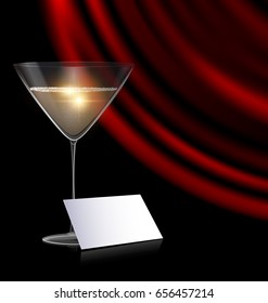 games card, glass and red drape