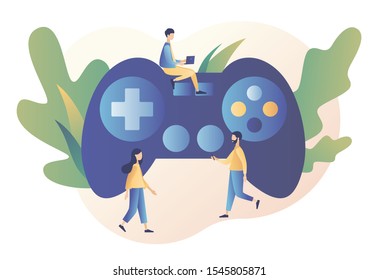 Gaming concept. People gamers playing online video game. Tiny people with a big controller. Modern flat cartoon style. Vector illustration