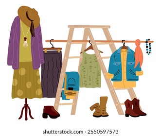 Garage sale things. Flea market products compositions. Vintage stuff arranging. Second Hand clothes and retro boots. Fair bazaar. Garment hangers and accessories rack