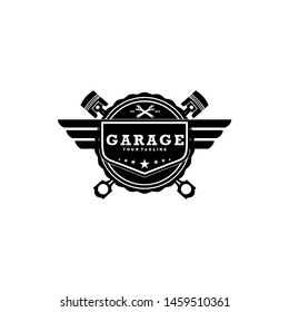 garage vintage  Auto Car or motorcycle Logo Badge wings with piston and wrench logo design vector