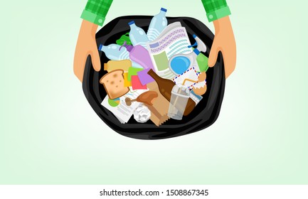 garbage bag and hand holding in top view, bag plastic waste and a lot of rubbish, stack paper glass and bottle plastic waste, garbage many in the plastic bin bag black, waste for separation recycle