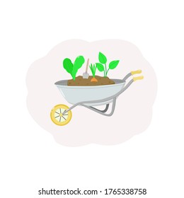 Garden cart with earth and plants and a shovel. Onions for planting, green plants.