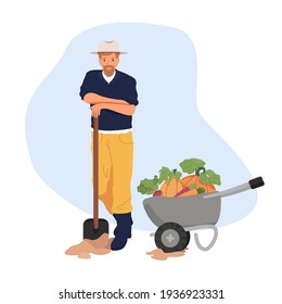 Garden concept. Harvesting. Gardener. A man with a shovel and a cart full of vegetables. Pumpkin, carrots, beets.