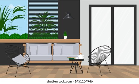 Garden furniture on the background of the wall with plants.