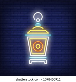 Garden lantern neon sign. Vintage lamp on dark brick wall background. Night bright advertisement. Vector illustration in neon style for decoration or Islamic holiday