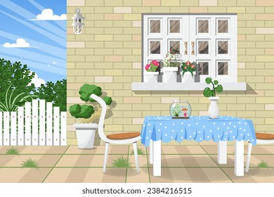 Garden next to the house with fish jar on dining table and window.