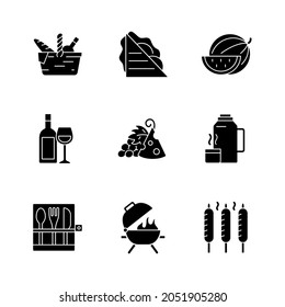 Garden party black glyph icons set on white space. Picnic basket. Sandwiches. Serving fruit. Alcoholic drink. Cheese and grapes. Thermos flask. Silhouette symbols. Vector isolated illustration