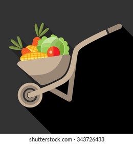 Garden wheelbarrow with vegetables.
