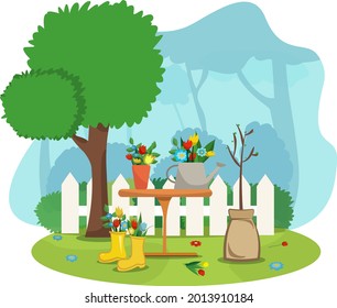 Garden white wooden fence gardening flowers in a bucket flowers in a watering can table tree