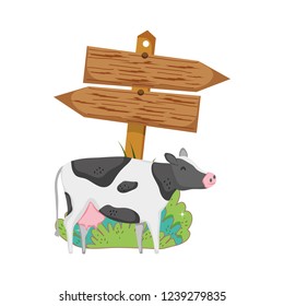 garden with wooden arrow signal and cow garden with wooden arrow signal and cow