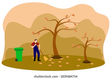 A gardener collects and cleans fallen leaves in the fall with a broom and garbage bin