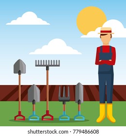 gardener with garden tools and plowing field