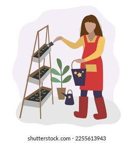 Gardener. The girl grows plants. Flower care. Transplanting and watering plants.