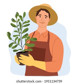 The gardener grows a flowerpot. Season for planting. Work in the garden. Man in work gloves. Work outside the city. Countryside. Farmers and gardeners doing job or agricultural hobby