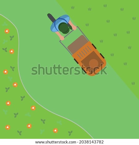 Gardener mowing backyard garden grass using cordless electric grass mower. Aerial view. gardening and landscaping industry