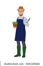 gardener on the farm, a man working in the garden, in the hands of a pot of grass