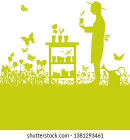 Gardener with rearing little plants in the garden at the table