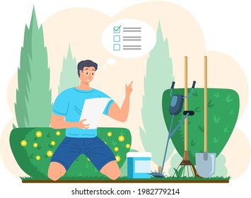 Gardener young male character sitting in backyard with green bushes holding inventory list in hands, fertilizers, trimmer, rake, shovel. Graden worker preparing for outdoor season, checks tools