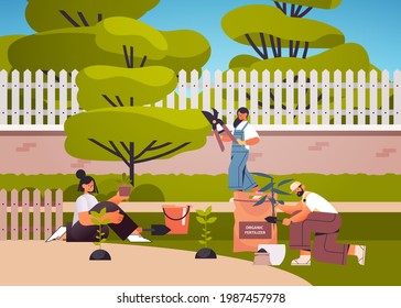 gardeners taking care of plants people working together planting gardens flowers in backyard gardening concept