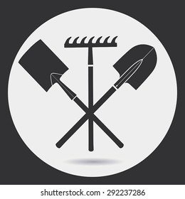 Gardening. Landing is time - a shovel and a rake. A black silhouette on a light background in a round frame.