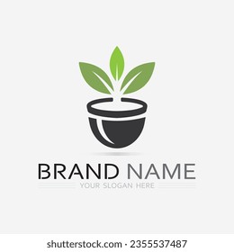 Gardening logo with shovel icon and tree with green leaves logo template.